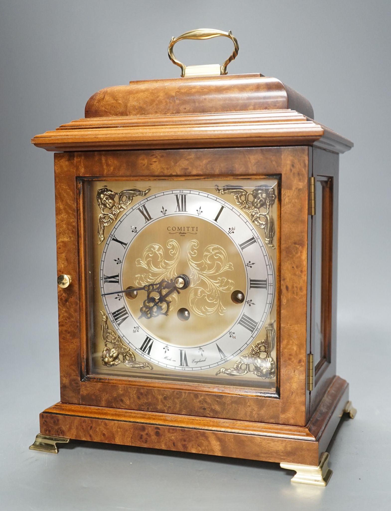 A George II style burr walnut striking and chiming eight day bracket clock, by Comitti, 32cm